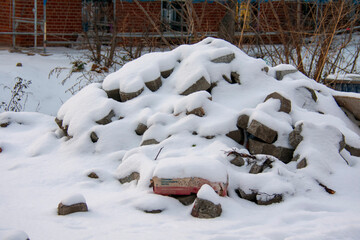 Snow covered pile of bricks during a blizzard in Berlin