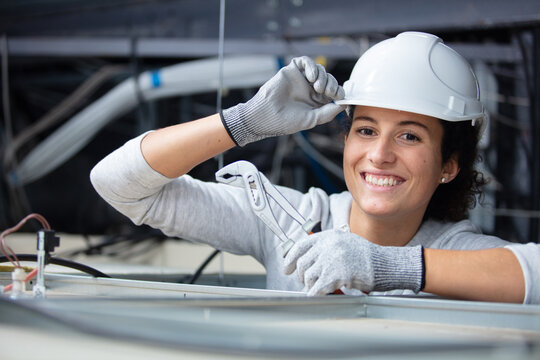 Woman Tipping Her Hard Hat