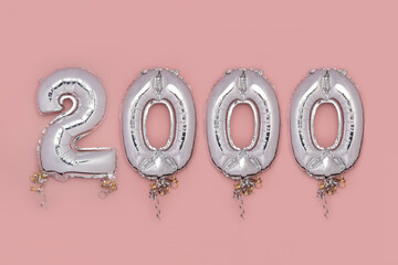 Balloon Bunting for celebration of 2000 made from Silver Number Balloons on pink background....