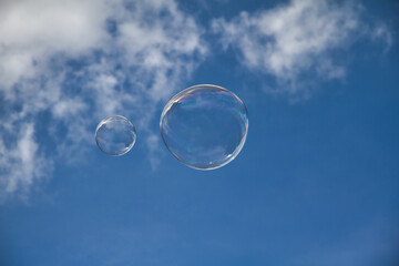 Soap bubbles in blue sky