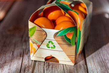 Healthy mandarin fruits in recyclable packaging