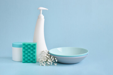 Dish detergent on a blue background. Cleaning in the house, apartment, office. Plastic packaging. Household chemicals. Different bottles of detergent. A copy of the space.