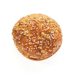 Hamburger bun with sesame seeds isolated on white background, top view