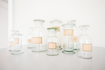 Empty uniquely shaped apothecary bottles with blank labels.