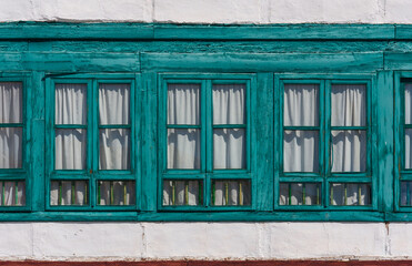Obraz premium Almagro. Beautiful windows on a facade in the Plaza Mayor. Castile-La Mancha, Spain
