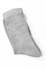 Folded gray socks isolated on white background