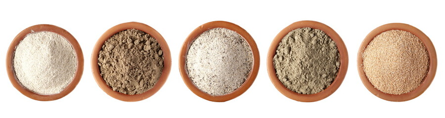 Set flour, integral barley, linseed protein powder, buckwheat integral, sunflower flour pile and spelt bran in clay pot, isolated on white background, clipping path