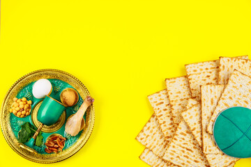 Fototapeta na wymiar Composition with matzo bread, kippah and seder plate. Passover Jewish holiday.
