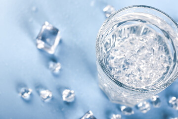 glass of soda water with ice. Soft selective focus