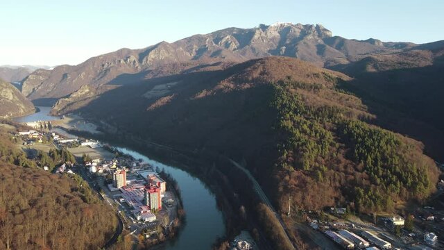 Aerial drone Valcea landscape near Calimanesti Caciulata, Olt River monastery in mountain Cozia, water Olt Valley beautiful gorge river in Romania.