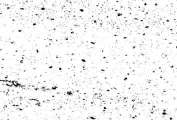 Small uneven spots and particles of debris. Abstract vector texture.  Distressed uneven background. Grunge texture overlay with fine grains isolated on white background. Vector illustration. EPS10.
