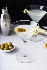 Classic lemon drop martini with olives and a lemon twist