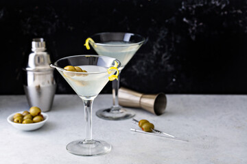 Classic lemon drop martini with olives and a lemon twist