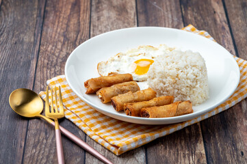Shanghaisilog  (profile)- is a famous Filipino meal that consists of fried rice, egg and spring rolls.