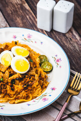 Pancit Malabon (vertical) is a Filipino dish that is a type of pancit, or stir-fried noodle dish, which originated in Malabon, a city in the Philippines.

