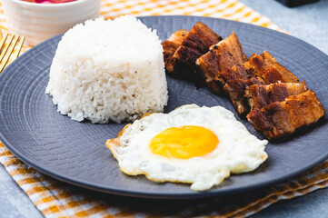 Porksilog (profile top  shot) -is a famous Filipino meal that consists of fried rice, egg and fried pork slices.