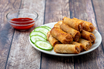 Pork Lumpiang Shanghai (center) is a Filipino favorite, its a dish usually served at parties and feasts. This is very similar to a spring roll.