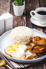 Chicksilog (vertical wings other side) -is a famous Filipino meal that consists of fried rice, egg and fried chicken.