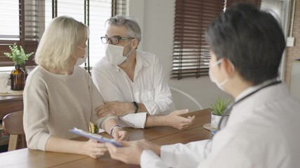 Concept of physicals consultant for elderly at home.Doctor explain to senior couple with annual check up report.Medical service delivery at home for elderly people.Health care concept. - Powered by Adobe