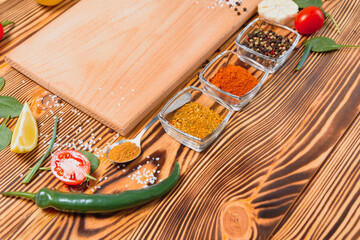 Cooking table. Background with spices and vegetables. Top view. Free space for your text.