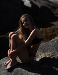 Beautiful tanned brunette at the beach. 