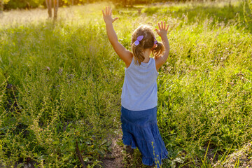 little girl playing on the farm 