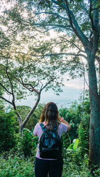 Young girl enjoying a beautiful view and taking photos in Merendon San Pedro Sula Honduras