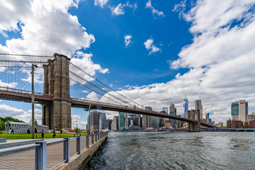 Wide angle view Brooklyn Bridge with lower Manhattan skyline, One World Trade Center Empire Fulton...