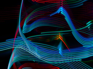 light painting photography, waves of vibrant color against a black background. Long exposure photo of vibrant fairy lights in abstract