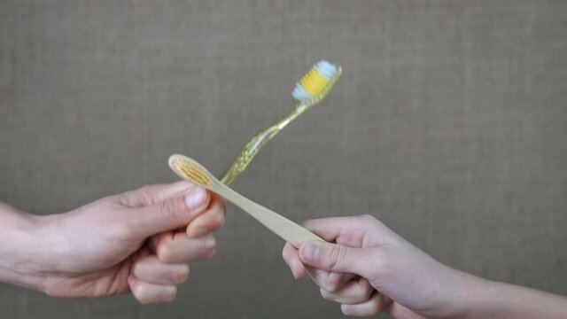 Plastic and natural products. A view of a battle between ecp and plastic teethbrush in the room.