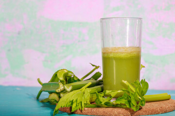 Healthy Celery diet for the treatment of incurable mysterious diseases. Fresh celery juice squeezed out on a juicer.drink, vegetable juice, studio shot
