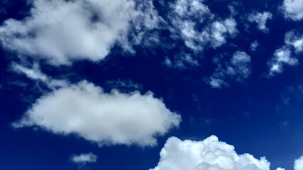 Fototapeta premium Beautiful white clouds, blue sky, the azure stratosphere, and spindrift, with texture background in nature for wallpaper pattern concept.