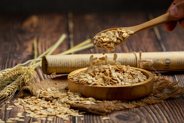 Fototapeta na wymiar raw barley grain in wooden background