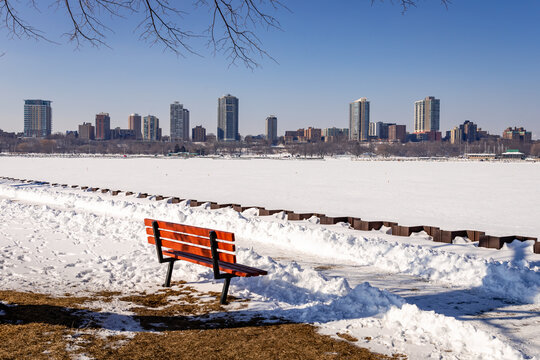 A bench along the shore of the Milwaukee, Wisconsin Harbor waits for springtime visitors
