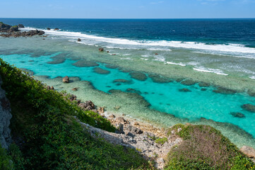 Beautiful scene seen from above, beautiful sea with their incredible colors of blue and green, and coral reefs appearing throughout the seascape in a low tide forming a natural sea pool.