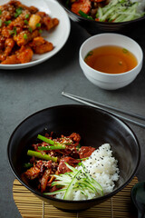 Stir Fried Pork with Korean Sauce on dark background