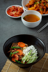 Stir Fried Pork with Korean Sauce on dark background
