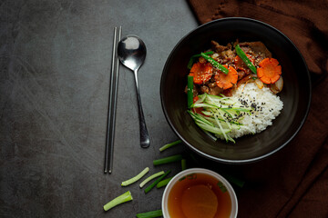 Stir Fried Pork with Korean Sauce on dark background