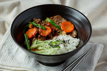Stir Fried Pork with Korean Sauce on dark background