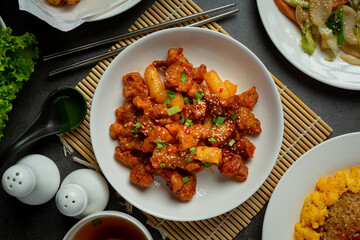 Korean sauce fried chickens on dark background