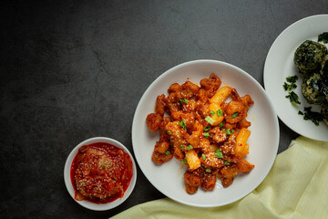 Korean sauce fried chickens on dark background