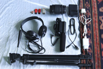 photo, video, and recording equipment include microphones, earphones, cellphones, camera lenses, tripods, flashdish, chargers, data cables.