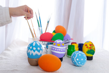 Fototapeta na wymiar Asian young woman painting Easter eggs