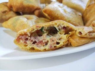 Martabak Telor Mini in Whitw Plate. is Traditional Food From Indonesia