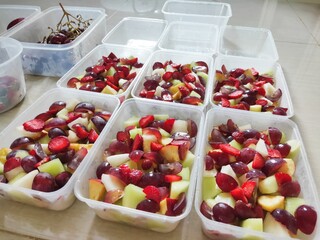 Fruit Salad, Strawberry, Grape and Orange in Plastic Container.