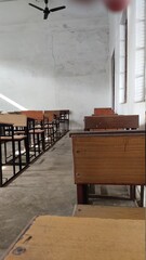 A classroom with wooden tables 