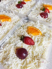 Fruit Salad With Cheese, Strawberry, Grape and Orange in Plastic Container.