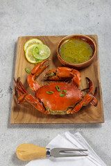 Kepiting kuah kari or traditional Javanese crab curry soup with coconut milk.