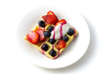 Waffles, strawberries, blueberries with yogurt