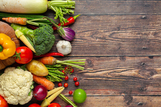 healthy vegetables on wooden table,World food day - Powered by Adobe